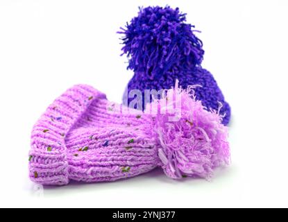 Two bobble hats against a white background Stock Photo