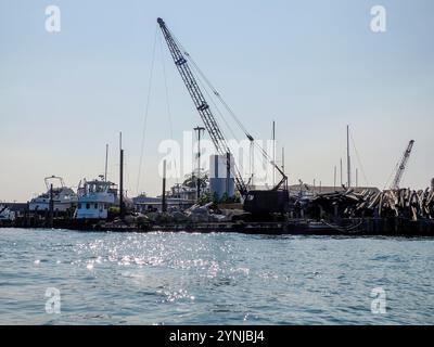 wood logs on pier in greenport harbor port long island new york view panorama Stock Photo