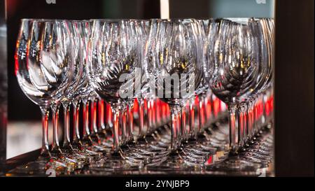 Rows of wine glasses at a reception. Stock Photo