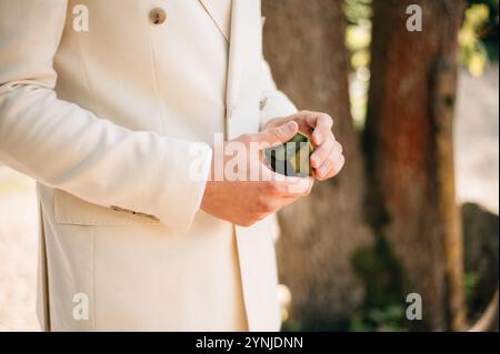 the groom holds a box with a ring Stock Photo