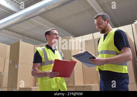 Worker in a warehouse in the logistics sector - transport and processing of orders in trade Stock Photo