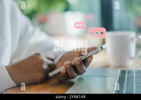 Woman using smartphone with social web icon popup on the phone in living room at home, Woman using cellphone for searching data and social media on in Stock Photo