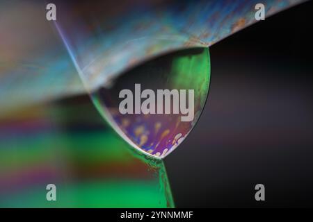 Silver liquid connections, bubble in macro, movement of liquid in a bubble, abstract background, surrealistic flow Stock Photo