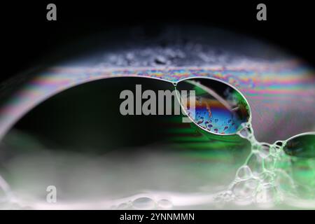Silver liquid connections, bubble in macro, movement of liquid in a bubble, abstract background, surrealistic flow Stock Photo