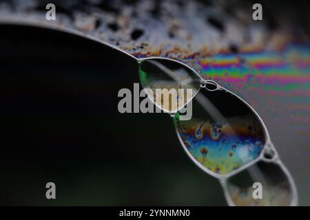 Silver liquid connections, bubble in macro, movement of liquid in a bubble, abstract background, surrealistic flow Stock Photo
