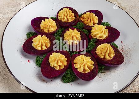 Stuffed eggs, stained with beetroot juice, purple, pitaya powder, top view, top view, close-up, no people Stock Photo