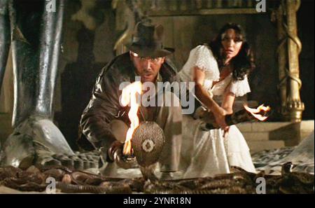 RAIDERS OF THE LOST ARK 1981 Paramount Pictures film with Harrison Ford  as Indiana Jones and Karen Allen as Marion Ravenwood Stock Photo