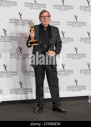 Timothy Spall winner in Best Performance by an Actor category for The Sixth Commandment poses in press room with the trophy during International Emmy Awards at Hilton Times Square Hotel in New York on November 25, 2024 Stock Photo