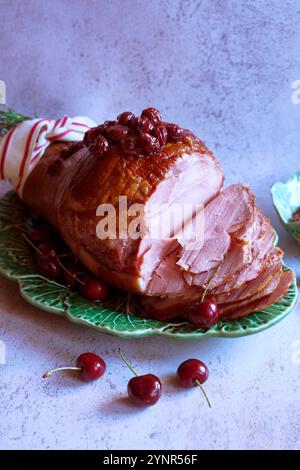Baked Ham with Cherry and Maple Syrup Glaze. Stock Photo