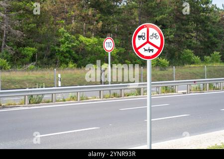 Prohibitory traffic signs on an empty European highway Stock Photo