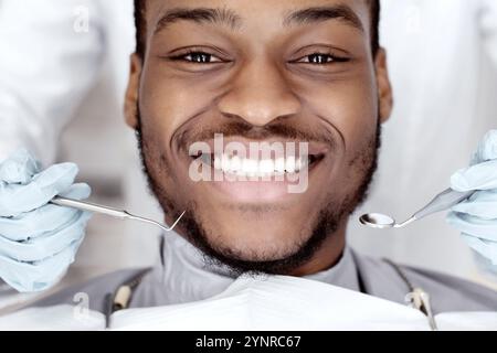 Closeup Of Happy Black Male Patient Getting Dental Treatment In Modern Clinic Stock Photo