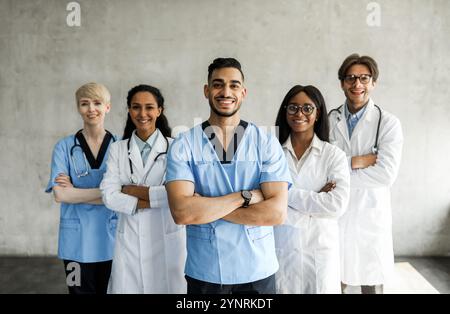 International team of doctors posing together while having morning breefing Stock Photo