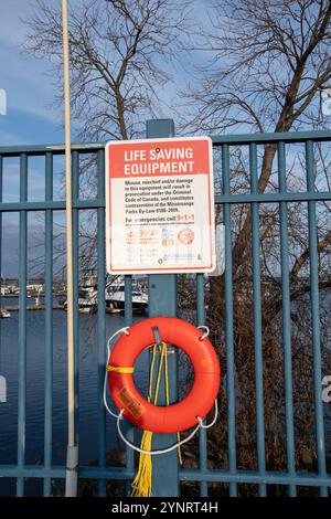 Life saving equipment sign and life ring at JJ Plaus Park in Port Credit, Mississauga, Toronto, Ontario, Canada Stock Photo