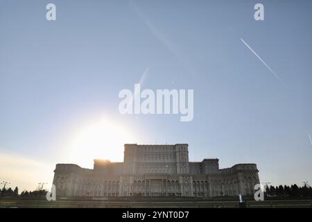 The Palace of Parliament (also known as the Republic's House or People's Palace), seen in Bucharest. It houses the Romanian Parliament, composed of the Chamber of Deputies and the Senate. Its construction was carried out by Communist dictator Nicolae Ceau?escu and completed in 1994. Designed by architect Anca Petrescu, its neo-classical style is inspired by the communist buildings of the 1950s. With an interior surface area of 350,000 m2, it is one of the largest buildings in Europe. (Photo by Apolline Guillerot-Malick/SOPA Images/Sipa USA) Stock Photo