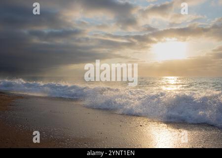 Turquoise waves meet the golden sands of Puerto Vallarta. Stock Photo