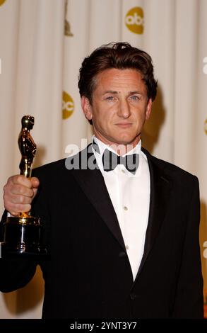 HOLLYWOOD, CA: Sean Penn with his Oscar® for Best Actor In A Leading Role for his portrayal of gangster Jimmy Markum in 'Mystic River' onstage in the Press Room at the 76th Annual Academy Awards® at the Kodak Theatre in Hollywood California on February 29, 2004. © Lee Roth / Roth Stock Celebrity Archives Stock Photo