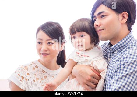 Girl being carried by family Stock Photo