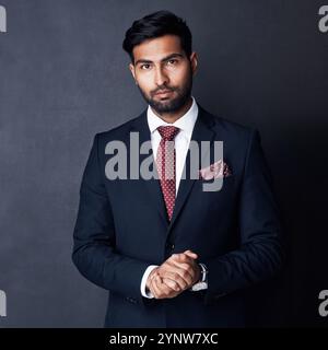 Portrait, businessman and pride for style with fashion, formal clothes and career on gray background. Male person, serious and elegant with jacket Stock Photo