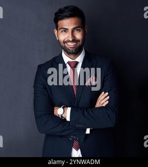 Indian guy arms crossed studio portrait Stock Photo - Alamy