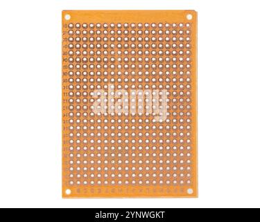 Orange prototyping PCB board with multiple holes Stock Photo