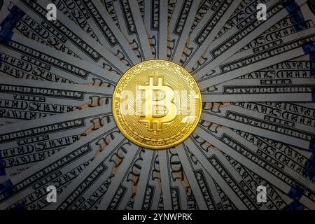 Golden Bitcoin on US dollar bills. Electronic money exchange concept. a gold bitcoin coin and dollars in the shape of a circle Stock Photo