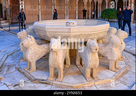 Granada, Spain - July 17, 2024: Ancient stone sculptures in the Fountain of the Lions in a courtyard of the Alhambra Palace Stock Photo