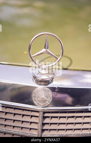 Kaliningrad, Russia - 08.06.2024: Detailed view of a classic MercedesBenz hood ornament and emblem, shining with luxury and elegance Stock Photo