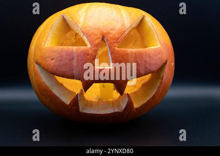 Pumpkin (Jack-o-lantern) close-up on a black background Stock Photo