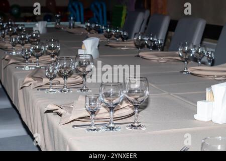 Restaurant interior. Preparation for a buffet. Tableware and food. Stock Photo