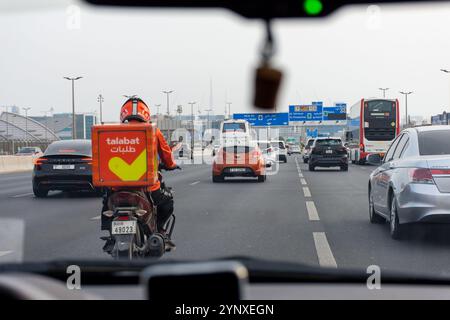 Delivery Rider Talabat Talabat delivery rider on a motorbike delivering food in Manama ...