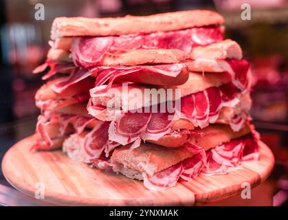 Bocadillos with Iberian Ham (jamón ibérico de bellota) in a Delicatessen shop. Stock Photo