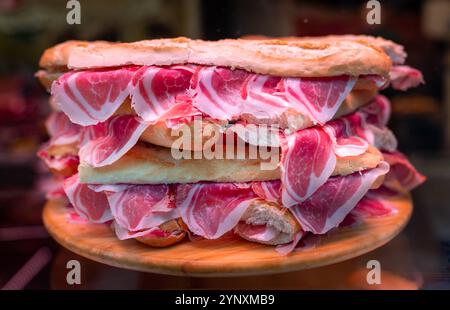 Bocadillos with Iberian Ham (jamón ibérico de bellota) in a Delicatessen shop. Stock Photo