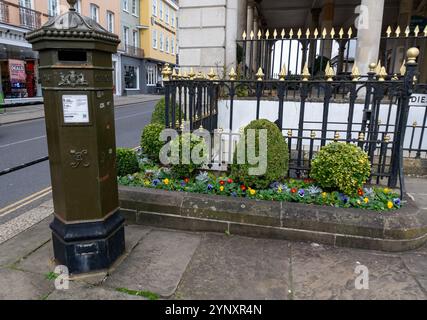 A green Victorian era post box next to the Guildhall in Windsor, Berkshire, UK Stock Photo