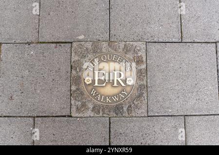 A pavement marker for the Queen's Walkway in Windsor, Berkshire, UK Stock Photo