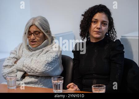 London, England, UK. 27th Nov, 2024. LAILA SOUEIF (left), the mother of jailed British-Egyptian activist and blogger Alaa Abdel Fattah, speaks at a press conference in London on the 59th day of her hunger strike. The event follows a meeting with UK Foreign Secretary David Lammy earlier in the day. Soueif, accompanied by her daughters SANAA SEIF (right) and Mona Seif, urged the UK government to increase diplomatic efforts to secure Abdel Fattah's release from Egyptian custody, where he remains detained under harsh conditions despite completing his sentence in September. (Credit Stock Photo