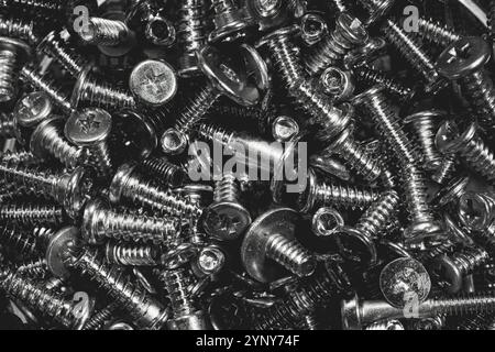 Mixed screws. Industrial background Stock Photo
