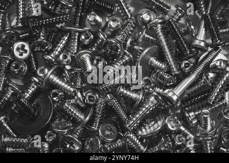 Mixed screws. Industrial background Stock Photo