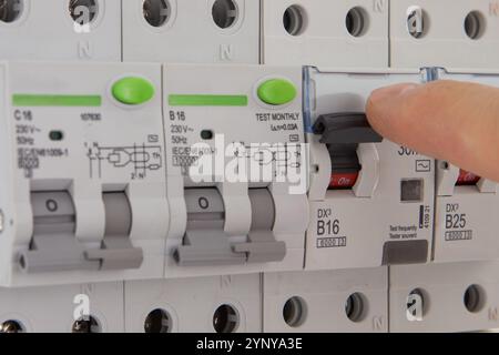 Switching Circuit Breaker in Electrical Panel Stock Photo