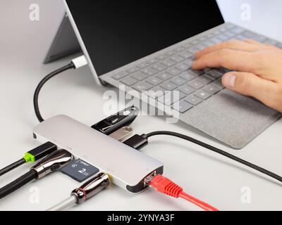 Multi-Port USB Hub Connected to Laptop Stock Photo
