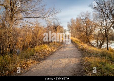 gravel hiking and biking trail in late fall scenery in one of natural areas in Fort Collin, Colorado Stock Photo