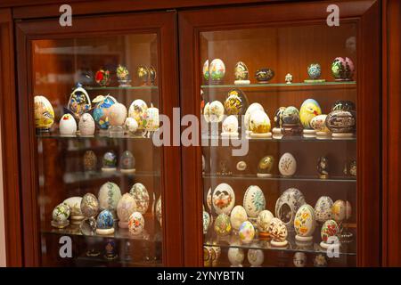 Cabinet with many decoratively painted stone eggs.In Poultry Museum (Pluimvee Museum) in Barneveld, province of Gelderland, The Netherlands. Stock Photo