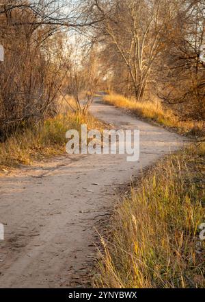 gravel hiking and biking trail in late fall scenery in one of natural areas in Fort Collin, Colorado Stock Photo