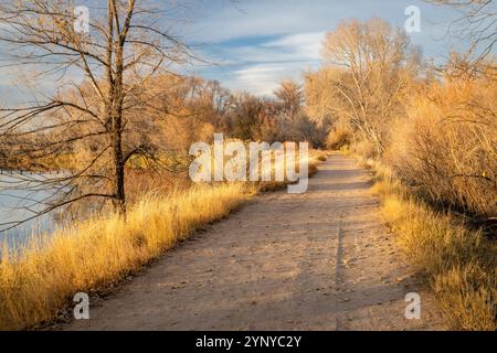 gravel biking and hiking trail in one of natural areas in Fort Collins, Colorado, late fall scenery at sunset Stock Photo