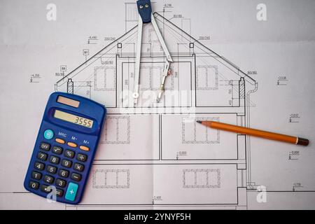 Architectural project being drawn using compass, ruler, pencil and calculator. Stock Photo
