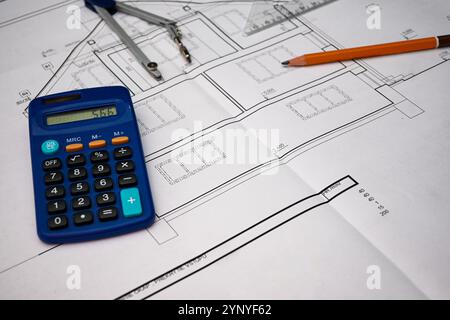 Architectural project being drawn using compass, ruler, pencil and calculator. Stock Photo