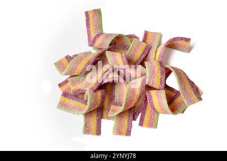 Colorful jelly candies strips in sugar sprinkles. Sour flavored rainbow candy background Stock Photo