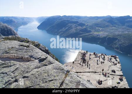 PULPIT ROCK, NORWAY, JULY 26, 2018: Unknown tourists enjoying the stunning view on Pulpit Rock. The Pulpit Rock or Preacher?s Chair is a tourist attra Stock Photo