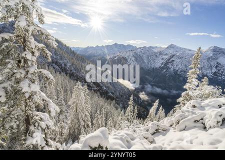 Winter landscape with deep snow and blue sky near the Plansee in Reutte, Tyrol Stock Photo