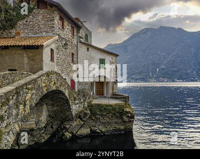 View of the stone bridge of Nesso village on Lake Como Stock Photo