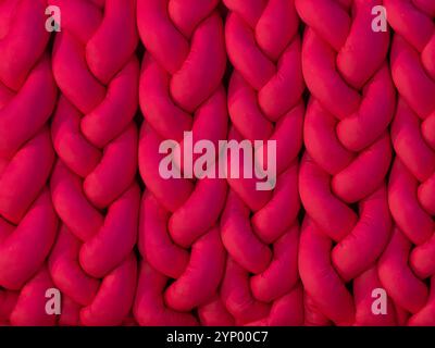 fluffy and puffy knitting background of dark pink or magenta color Stock Photo